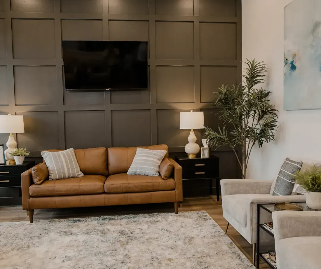 Warm, welcoming waiting room with leather sofa